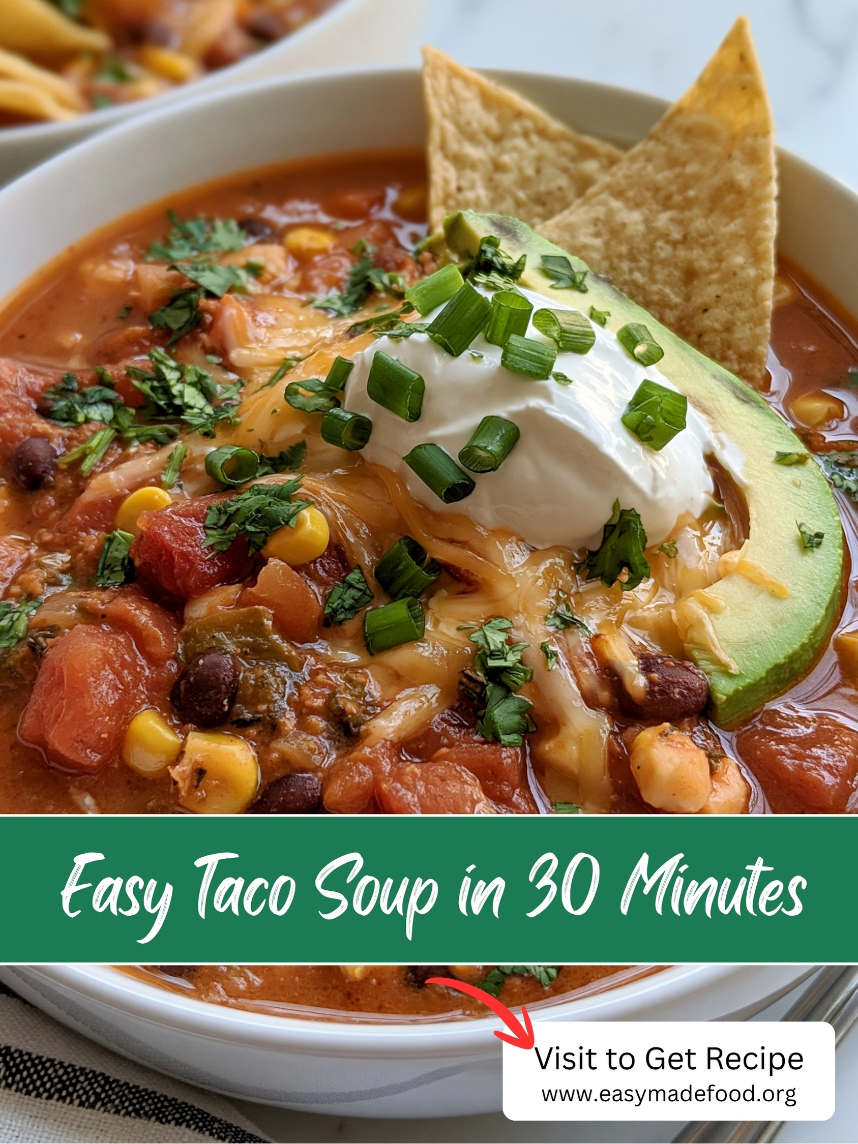 Easy taco soup in 30 minutes — hearty beef, bean and corn soup topped with cheese, sour cream and avocado, visit Easy Made Food to get the recipe